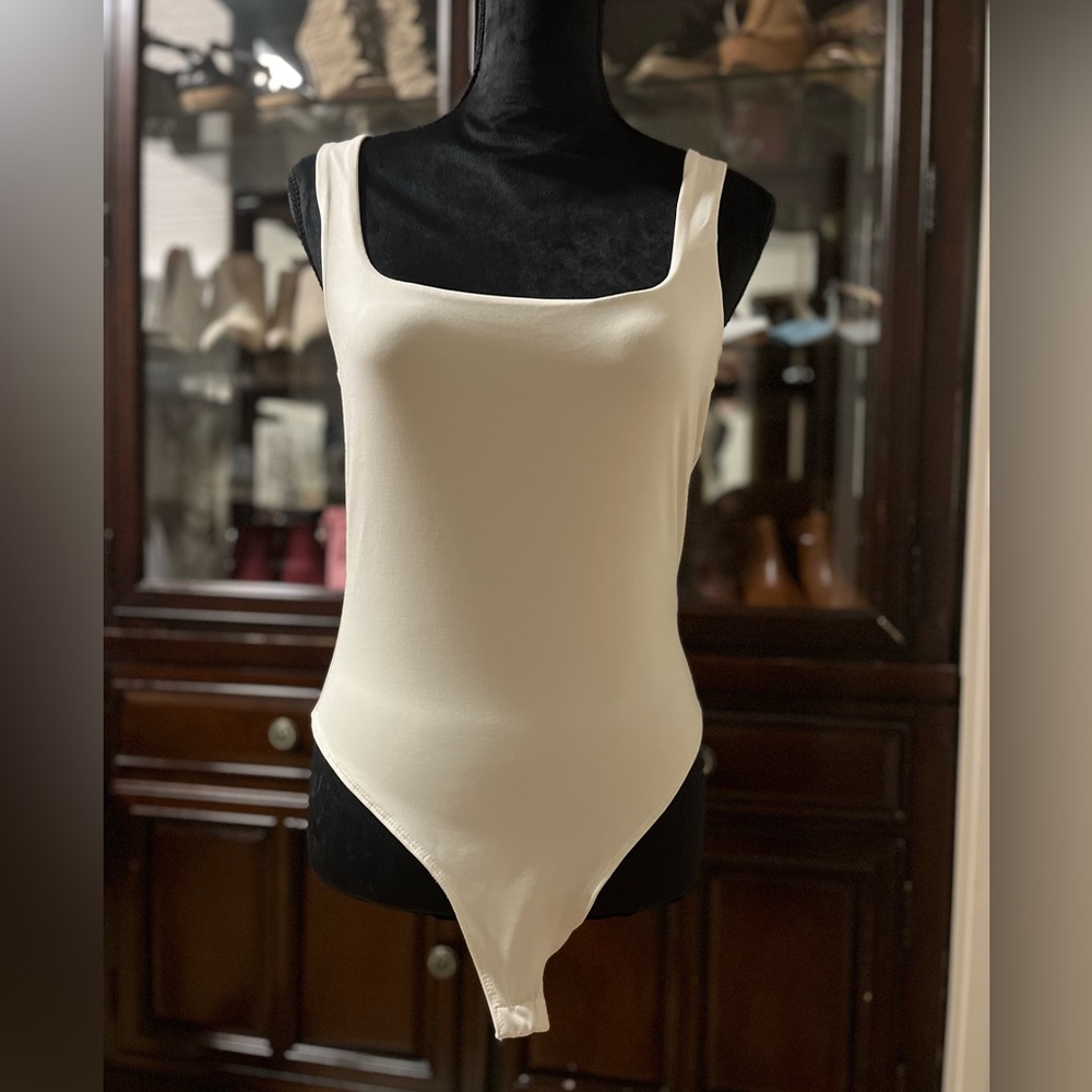 Bodysuit, cream colour, size XL, thong with 2-snap closure.